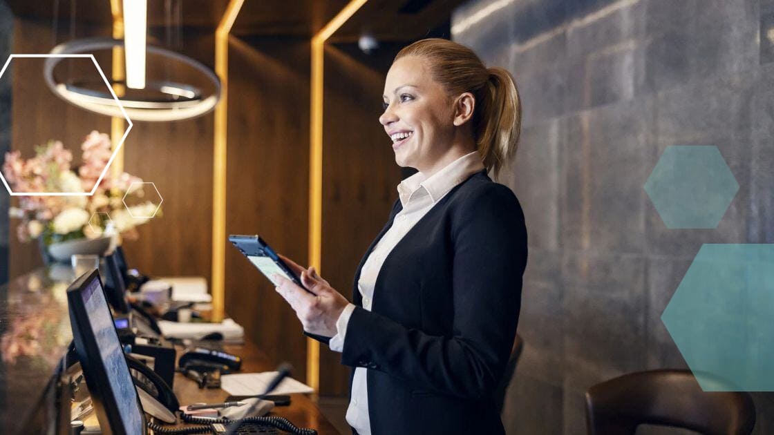 Hospitality employee working the front desk at a hotel